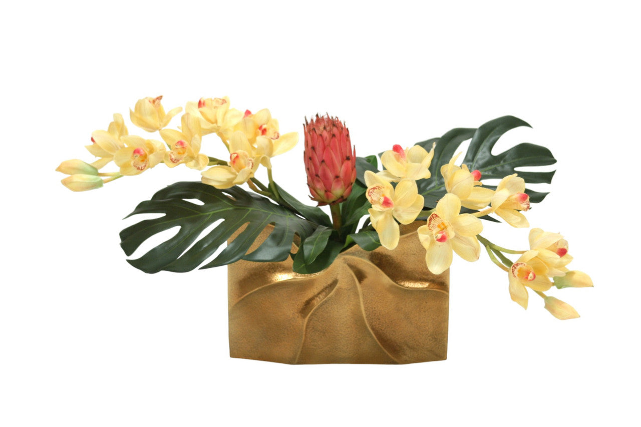 Distinctive Designs Tropical Mix Of Champagne Burgundy Orchids And Protea In A Gold Ritz Vase