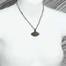Michal Golan Jewelry Michal Golan Medium silver evil eye necklace w/ pale green crystal center & edges on single, beaded chain, handmade at Michal Golan Studios USA