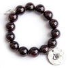 PowerBeads by jen Jewelry Average 7" Garnet paired with a silver hammered evil eye