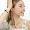 Michal Golan Small gold evil eye bracelet with crystal center, handmade at Michal Golan Studios USA