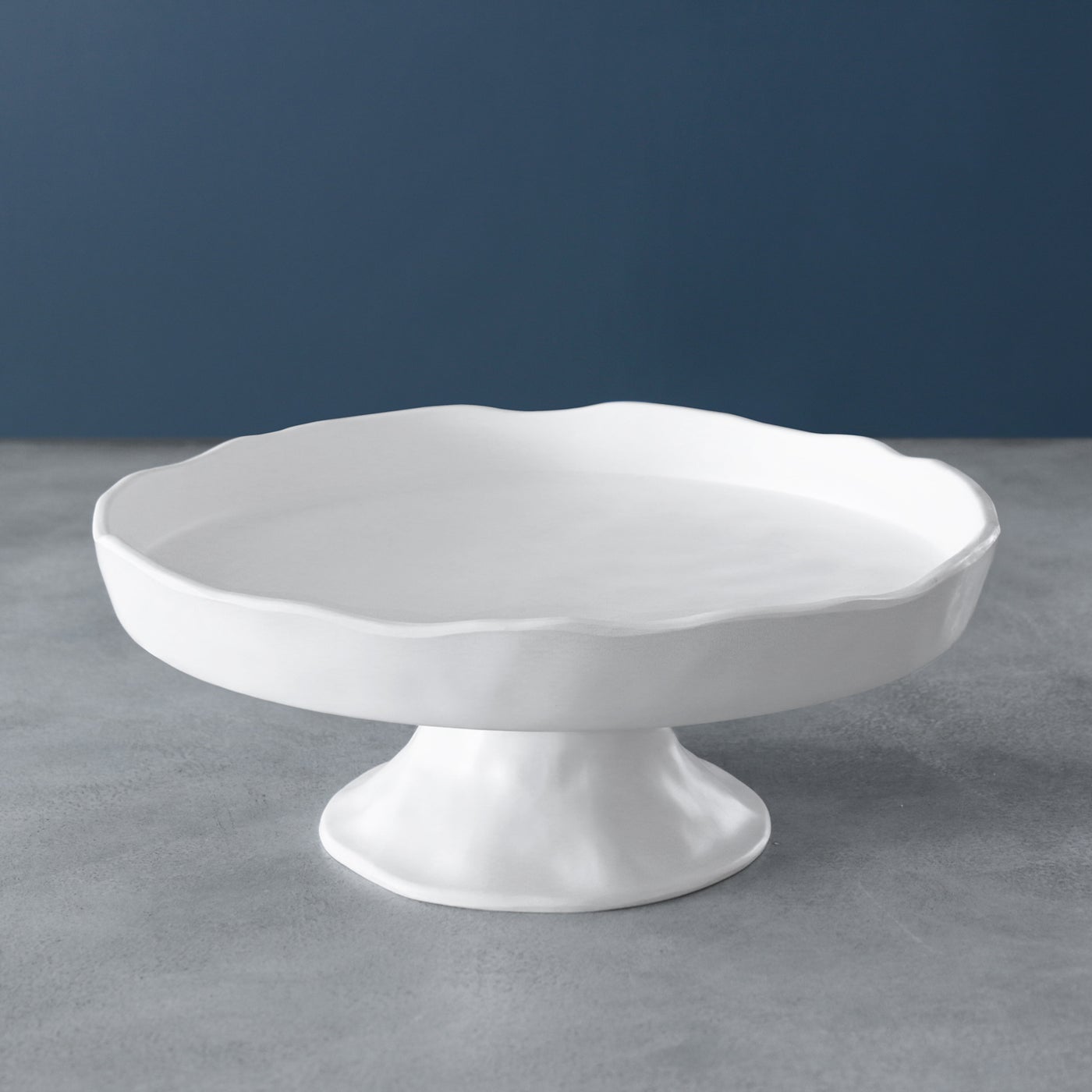 White pedestal cake outlet plate