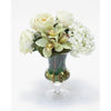 Waterlook® White Roses and Hydrangeas with Cymbidium Orchids in Clear Glass Urn